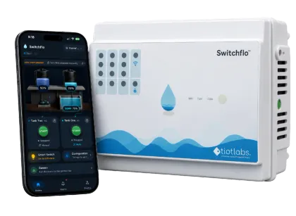 The SwitchFlo controller with the app open on a phone beside it, showing live tank and sump levels